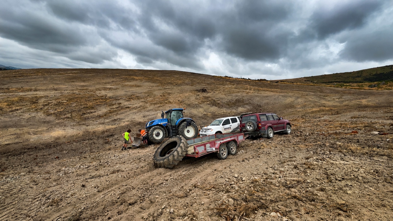 Tractor tyre swap on a hill block, with the Davo's ute and trailer on site